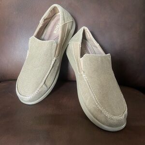Men’s Crocs, lightweight, slip-on loafer. Canvas upper. Rubber soles.